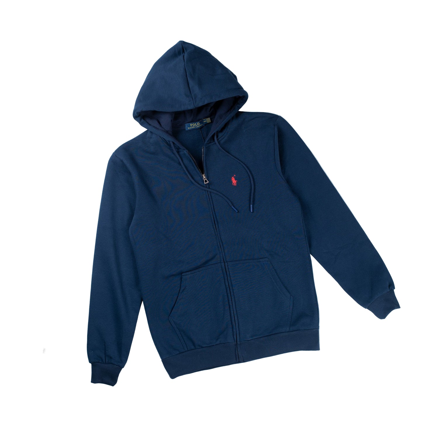 Navy blue hooded sweatshirt with a visible logo on the left chest area, displayed on a white surface with a small amount of snowfall, accompanied by sunglasses and a passport.